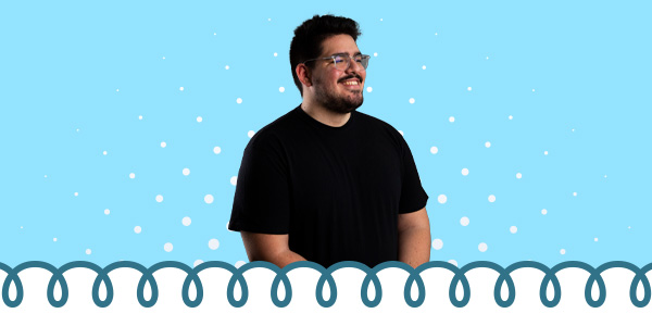 A student smiling to the right and a tight coil banner at the bottom